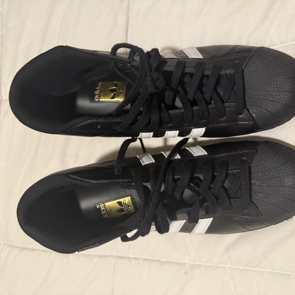 Adidas Men's Black Sneakers with White Accents and Gold Highlights